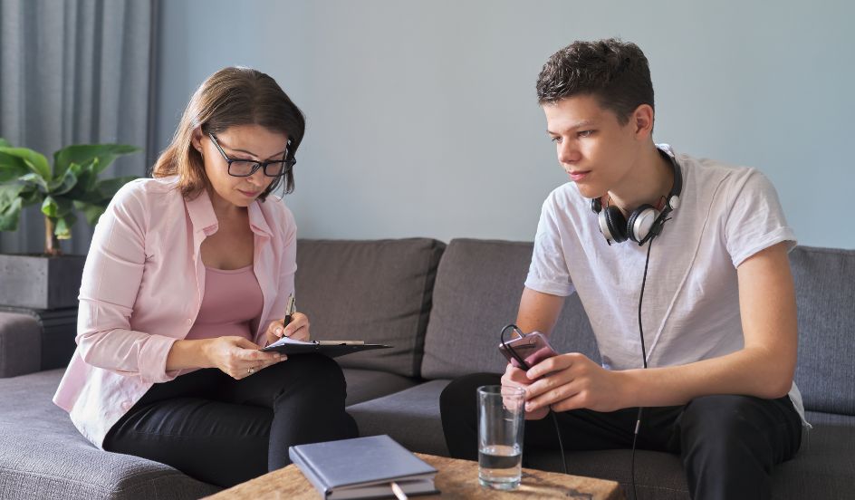 child and youth care working talking with teen