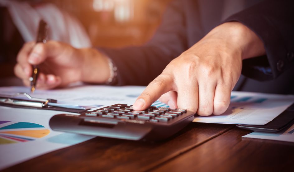 accounting technician working on a calculator