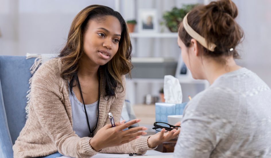 community service worker talking with client