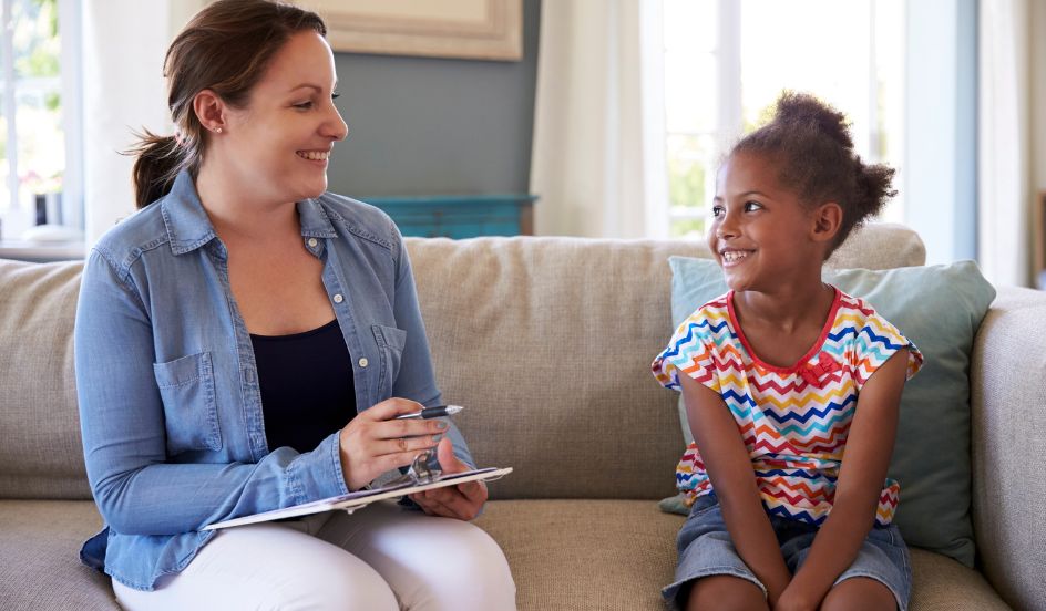 child and youth care worker talking with child