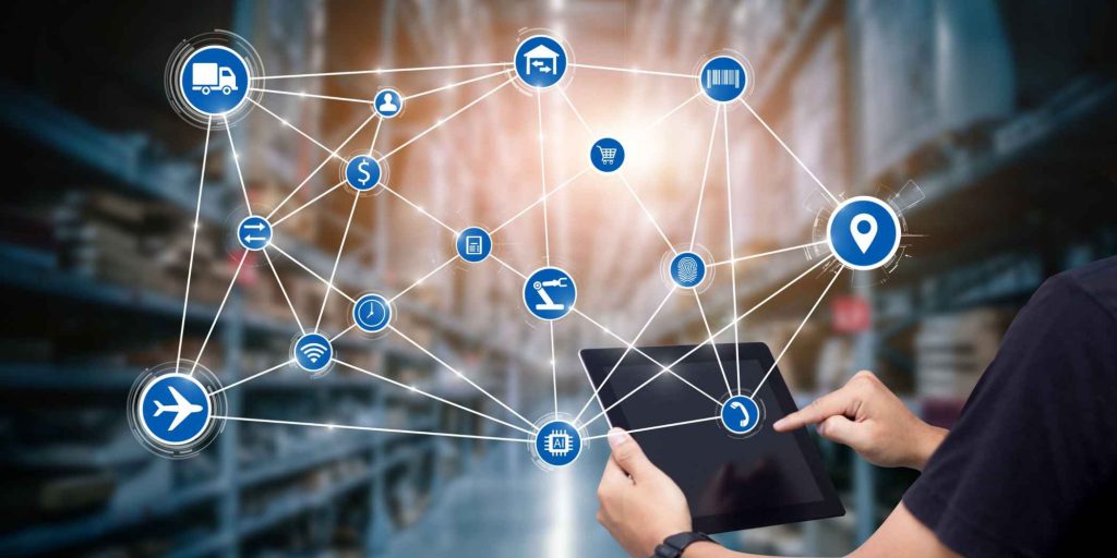 supply chain management matrix hovering over a tablet with a warehouse in the background